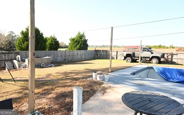 a view of a swimming pool with a lounge chair