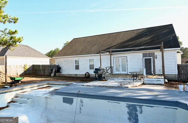 a view of the house with outdoor seating