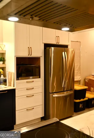 a view of a refrigerator in the kitchen