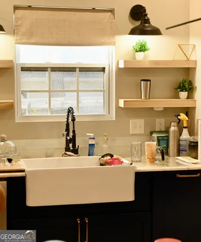 a bathroom with a sink and a window