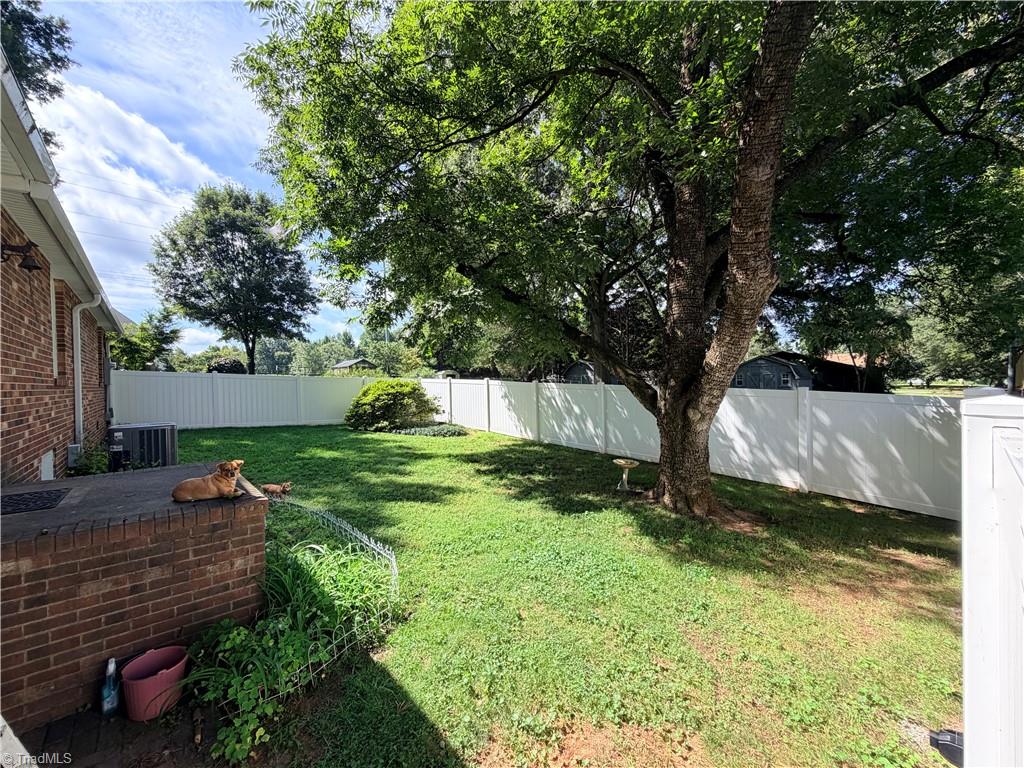 4608 High Point Road Kernersville, NC 27284 - Photo 32 of 33 Back yard inside vinyl fence. Of course, dogs not included!