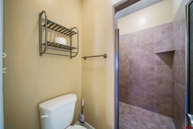 a white toilet sitting next to a bathroom sink