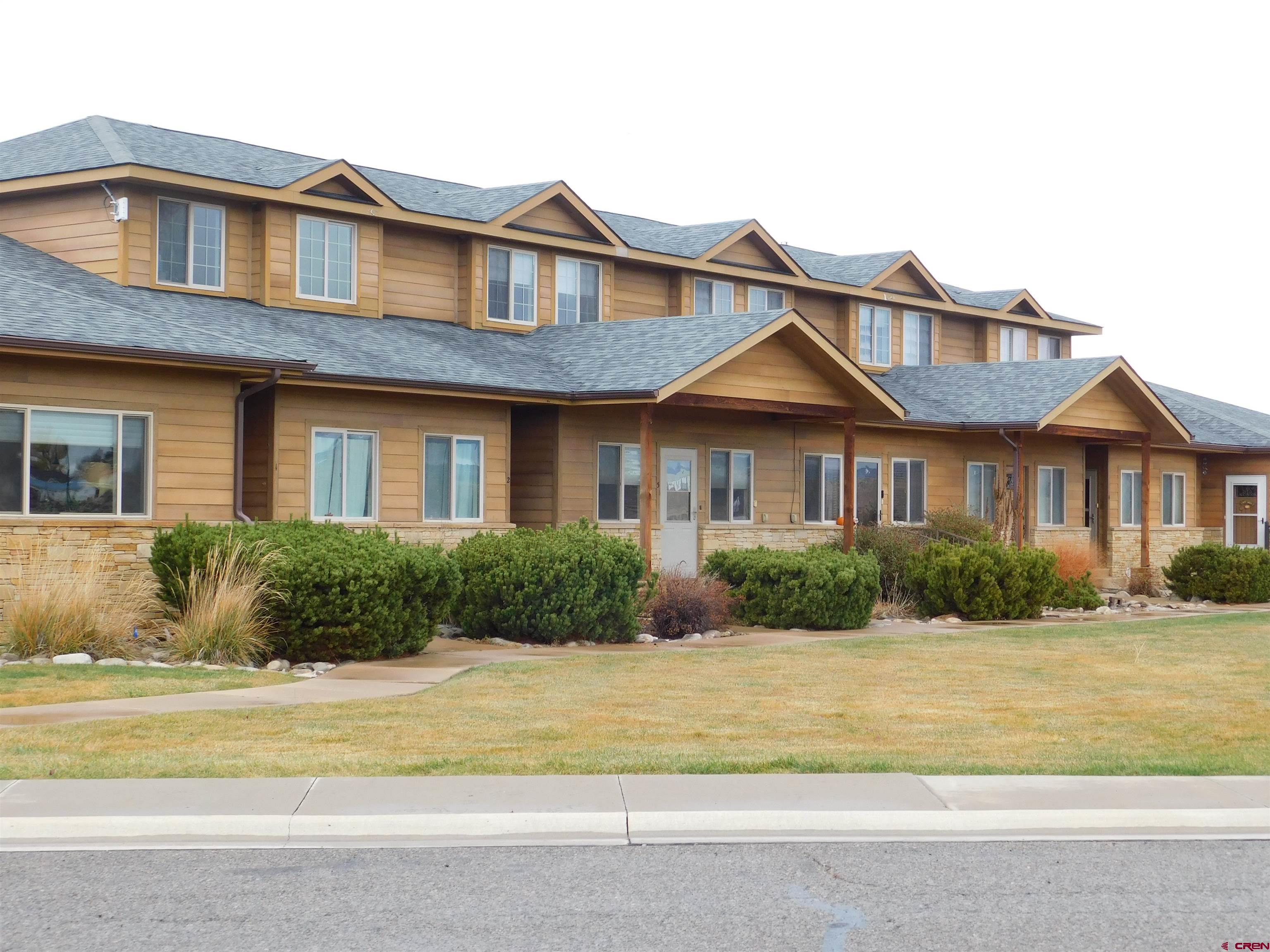 1630 Gateway Drive, Unit 3 Cortez, CO 81321 - Photo 2 of 34 a front view of a house with a yard