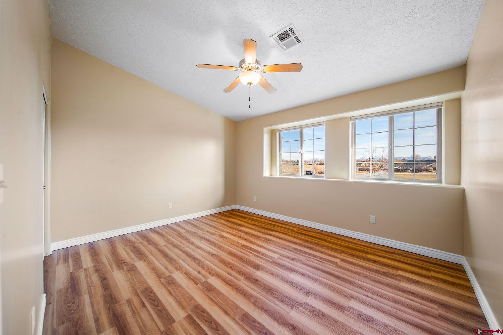 1630 Gateway Drive, Unit 3 Cortez, CO 81321 - Photo 21 of 34 a view of empty room with wooden floor and fan
