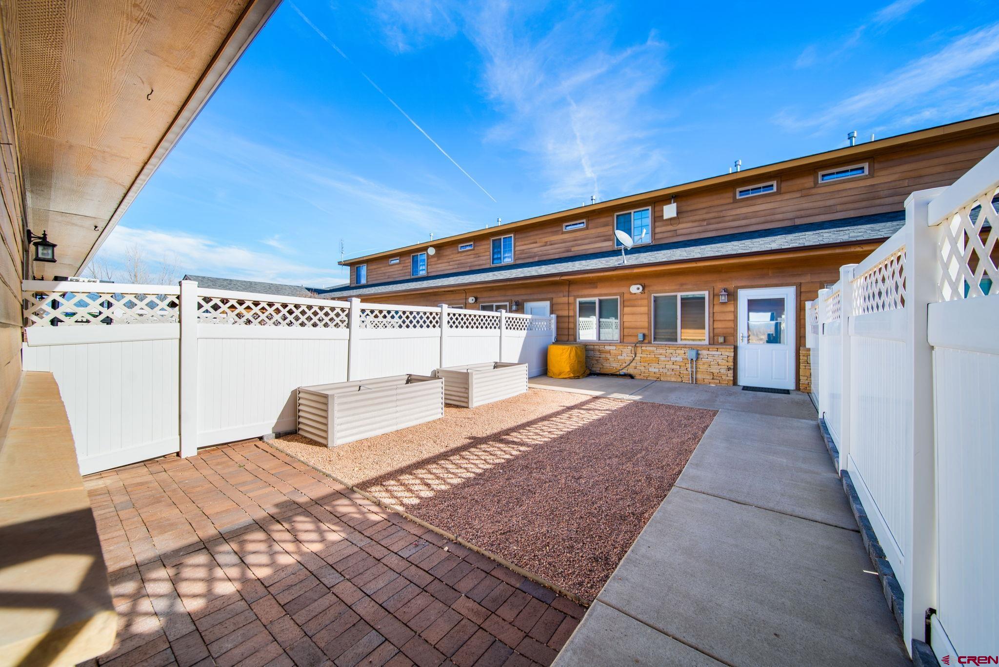 1630 Gateway Drive, Unit 3 Cortez, CO 81321 - Photo 29 of 34 a front view of a house with a yard