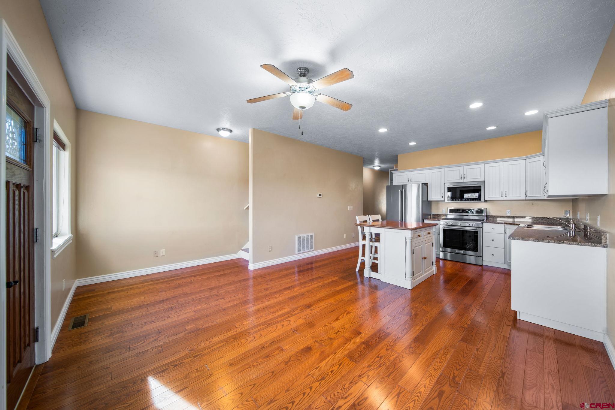 1630 Gateway Drive, Unit 3 Cortez, CO 81321 - Photo 6 of 34 a view of kitchen with cabinets and wooden floor