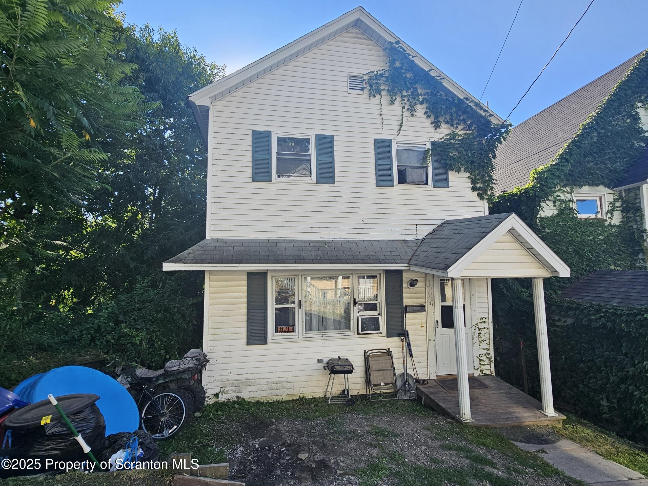 139 Terrace Street Carbondale, PA 18407 - Photo 1 of 9 a front view of a house with a garden