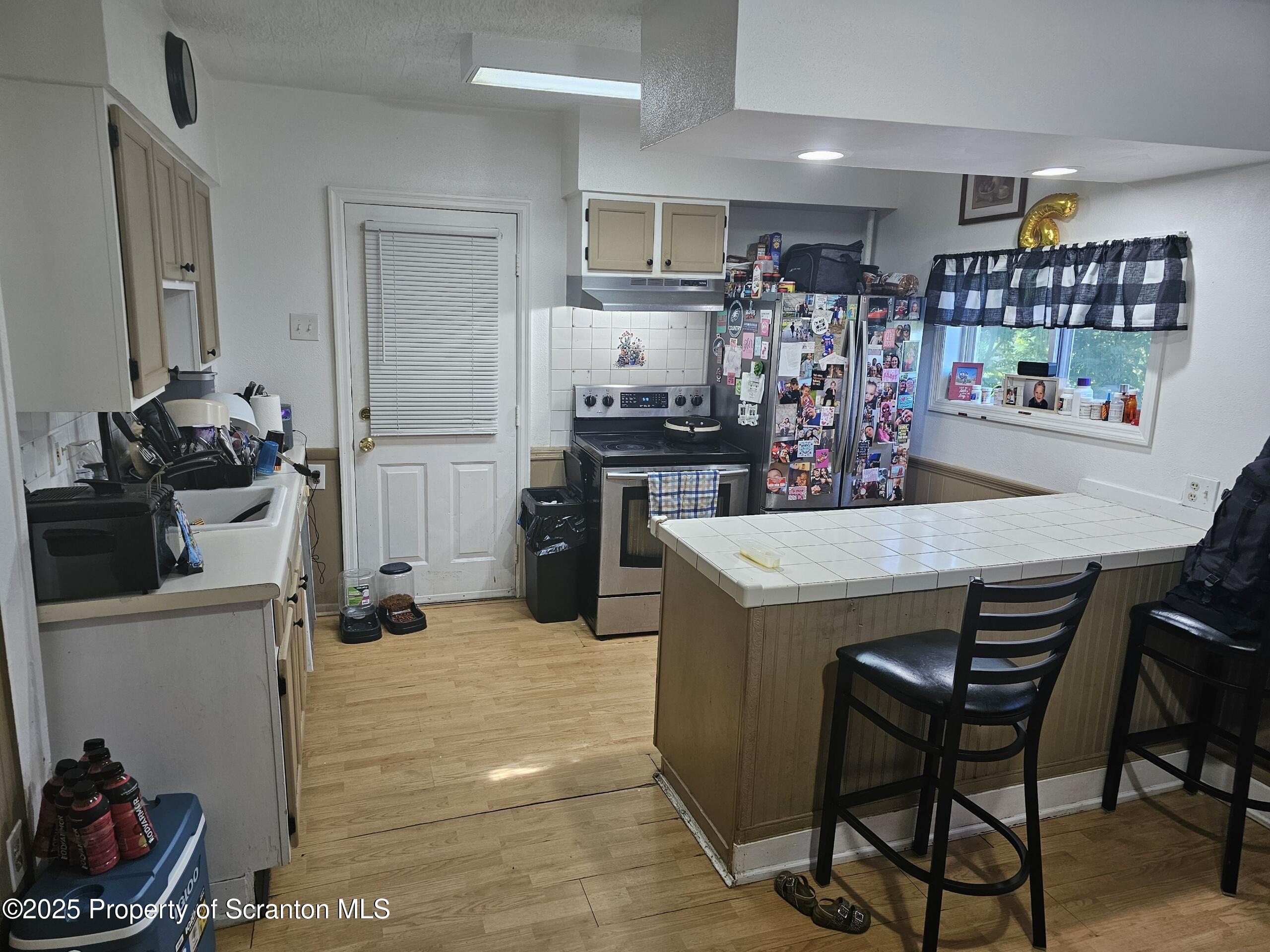 139 Terrace Street Carbondale, PA 18407 - Photo 6 of 9 a kitchen with a table and chairs in it
