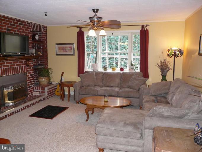 791 Hilltop Road Elkton, MD 21921 - Photo 2 of 20 a living room with furniture and a flat screen tv