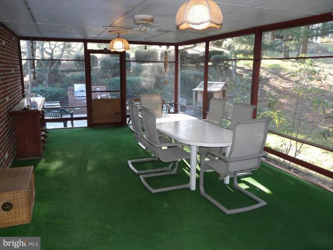 791 Hilltop Road Elkton, MD 21921 - Photo 14 of 20 a dining room with furniture and a floor to ceiling window