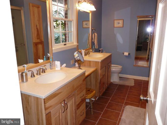 791 Hilltop Road Elkton, MD 21921 - Photo 6 of 20 a bathroom with a sink toilet and shower