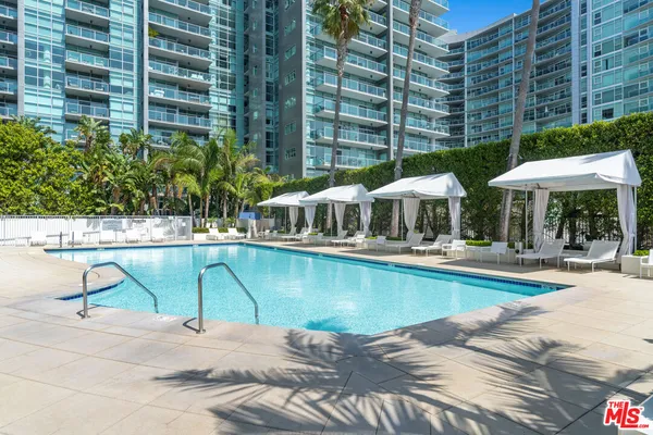 a view of a swimming pool with a patio