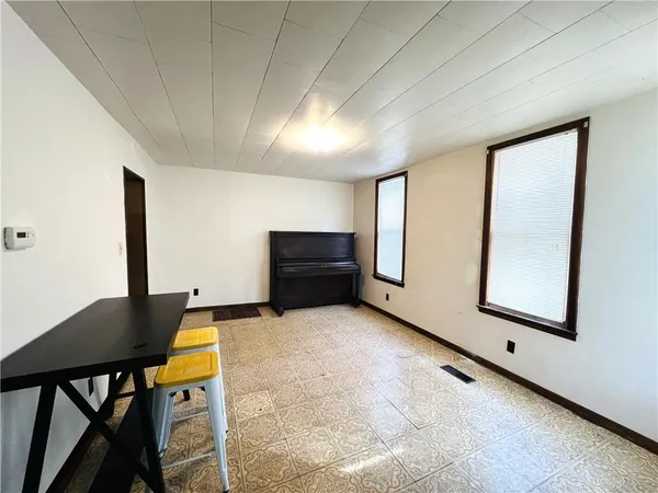 a view of room with furniture and window