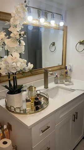 a bathroom with a sink and a mirror