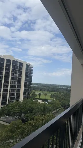 a view of a balcony with an outdoor space