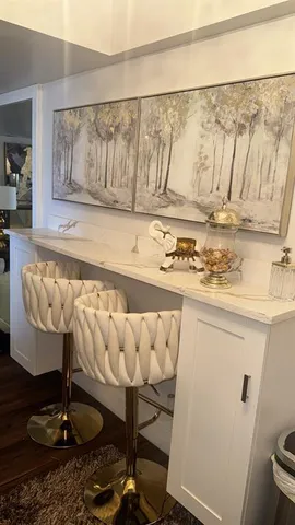 a view of kitchen with furniture and wooden floor