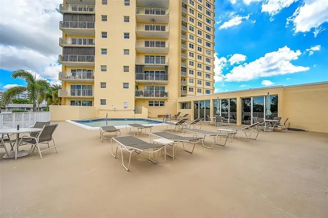 a view of a patio with swimming pool