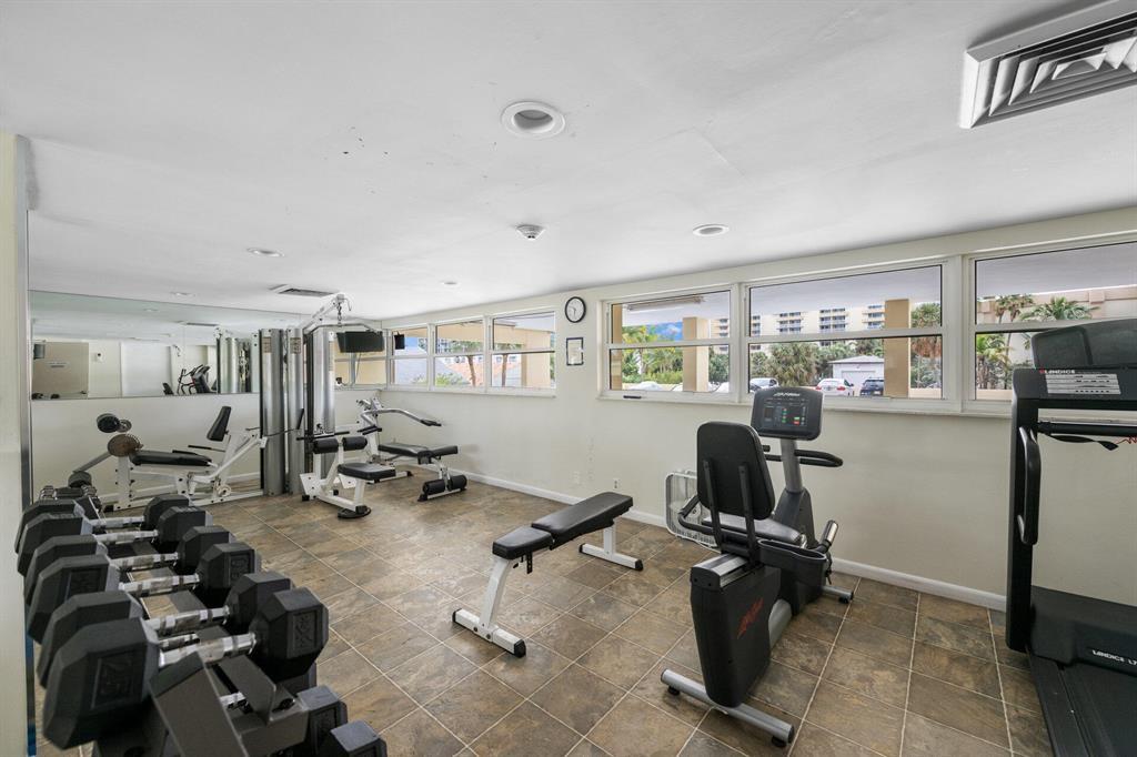 1200 Hibiscus Avenue, Unit 1106 Pompano Beach, FL 33062 - Photo 9 of 19 a view of a room with gym equipment