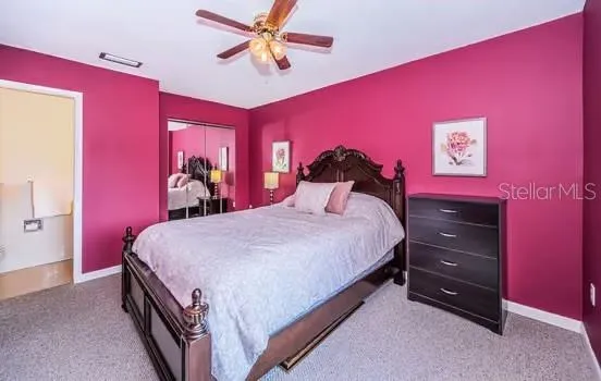 a bed room with a bed and a mirror