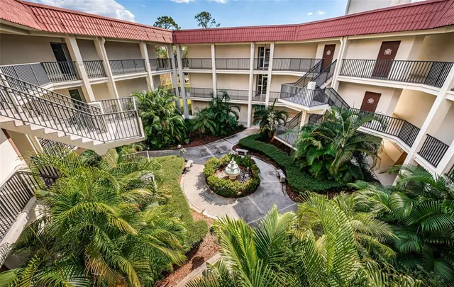 a vase of flowers sitting on a floor