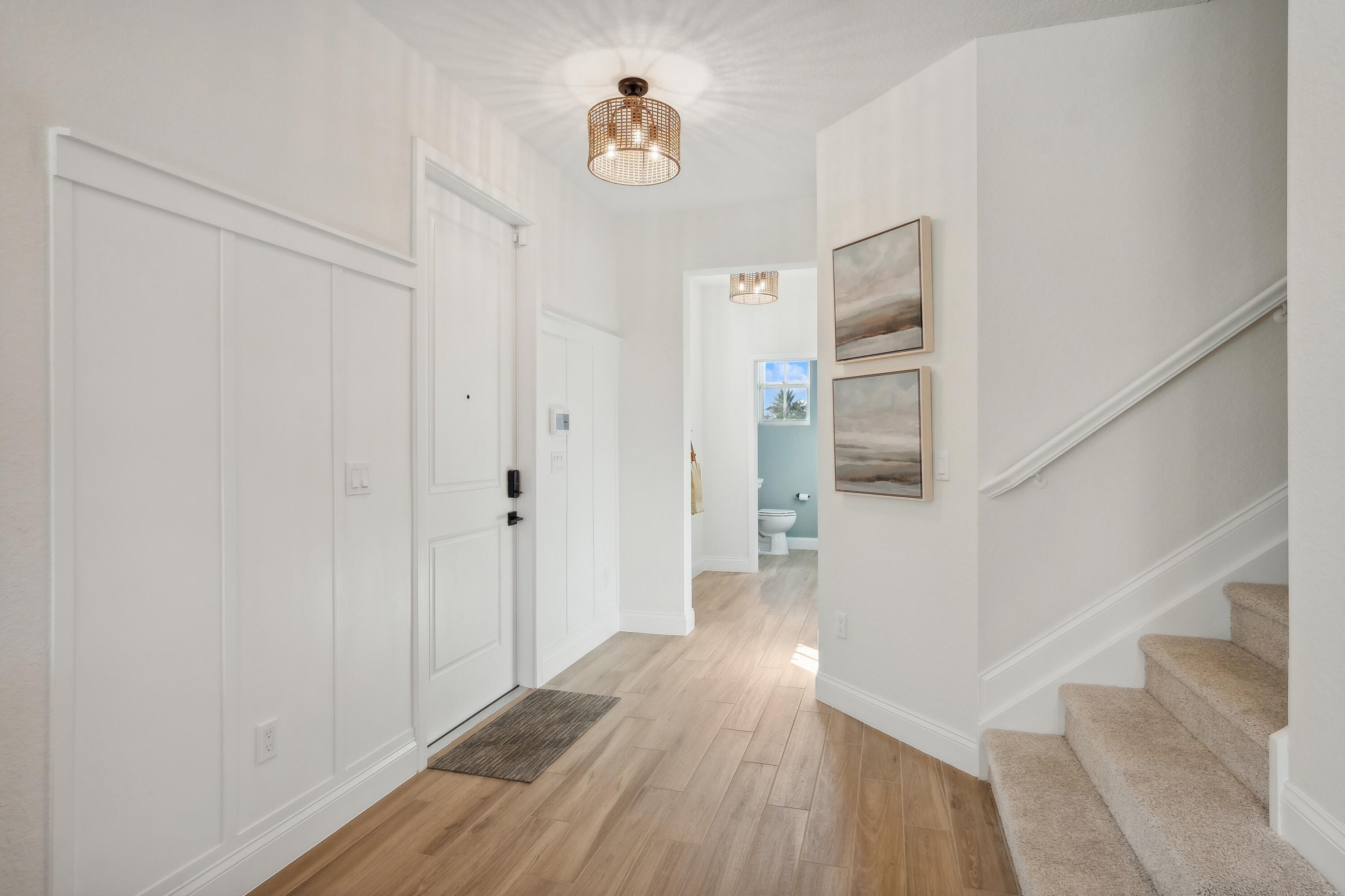 130 Southeast Birch Terrace, Unit 1580 Stuart, FL 34997 - Photo 16 of 44 a view of entryway with wooden floor