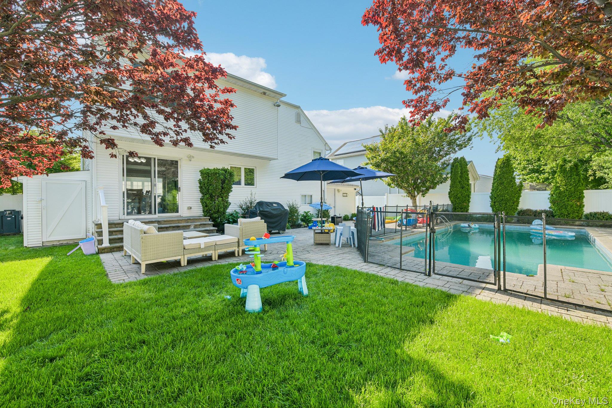 2821 Colonial Avenue Merrick, NY 11566 - Photo 29 of 29 a view of a house with backyard sitting area and garden