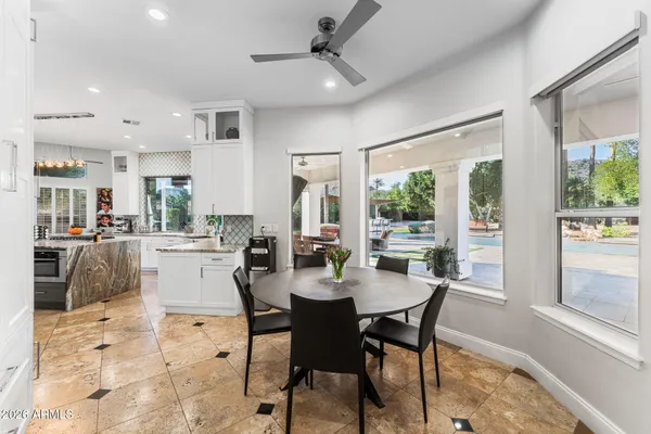 a view of a dining room with furniture window and outside view