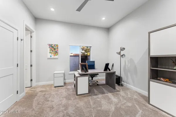 a large kitchen with stainless steel appliances kitchen island granite countertop a refrigerator and a stove top oven
