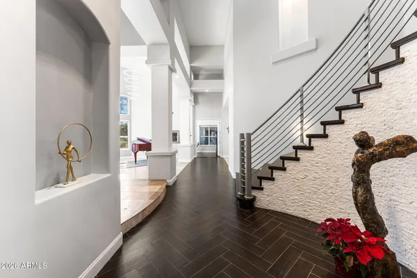 a large white kitchen with a large window