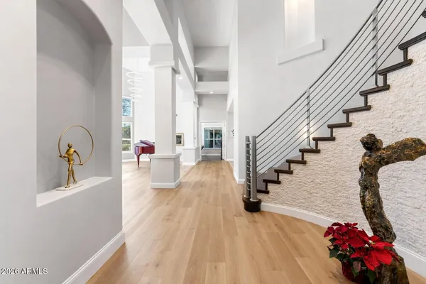 a large kitchen with stainless steel appliances granite countertop a sink and cabinets