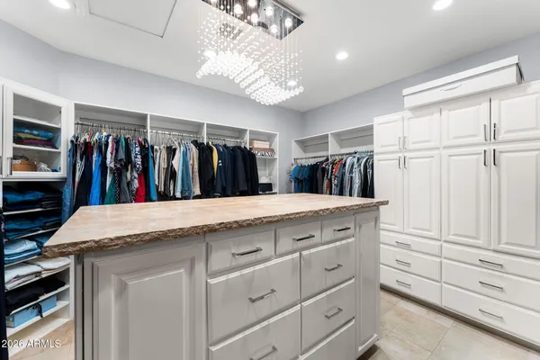 a room with pool table and windows