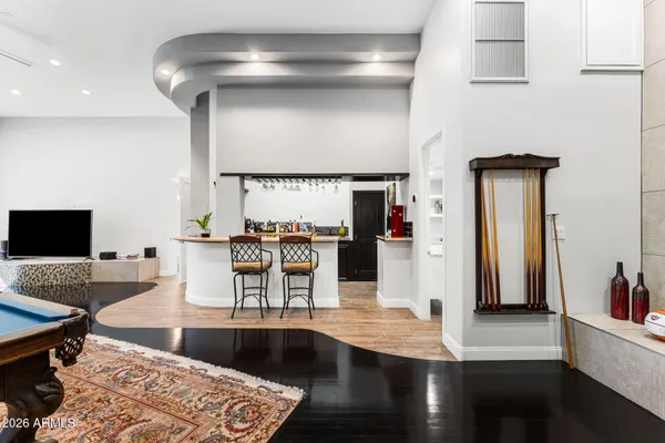 a view of a patio with a table and chairs