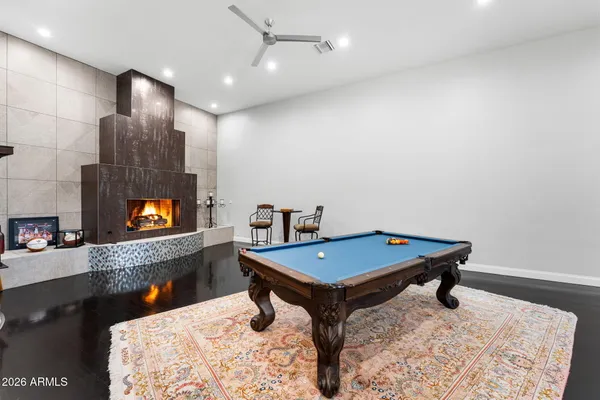 a view of a house with backyard kitchen and sitting area