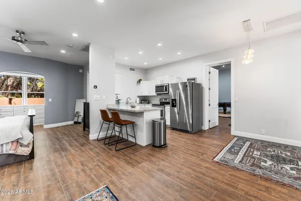 a view of a swimming pool with a patio