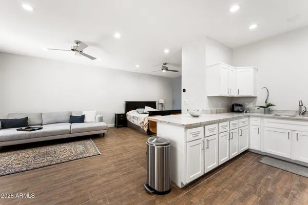 a view of a backyard with sitting area