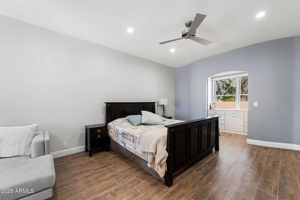 a view of swimming pool with outdoor seating and a garden