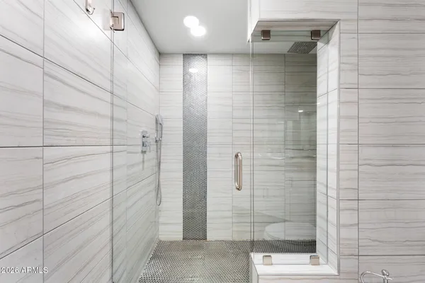 an aerial view of a house with yard and swimming pool