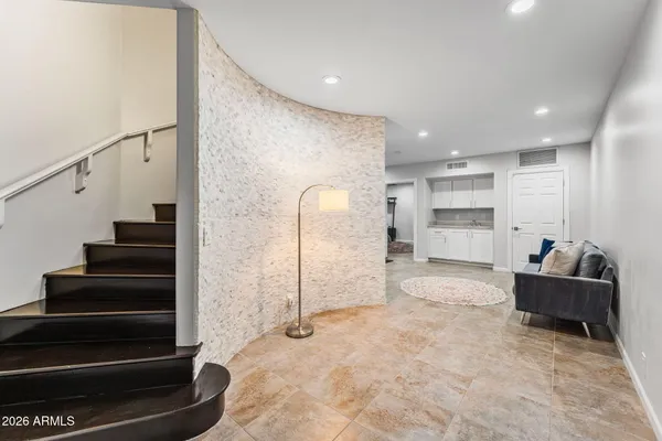 a swimming pool with outdoor seating and yard