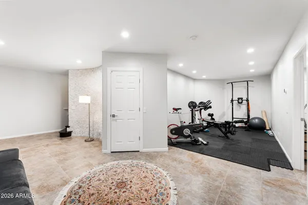 a front view of a building with a garden