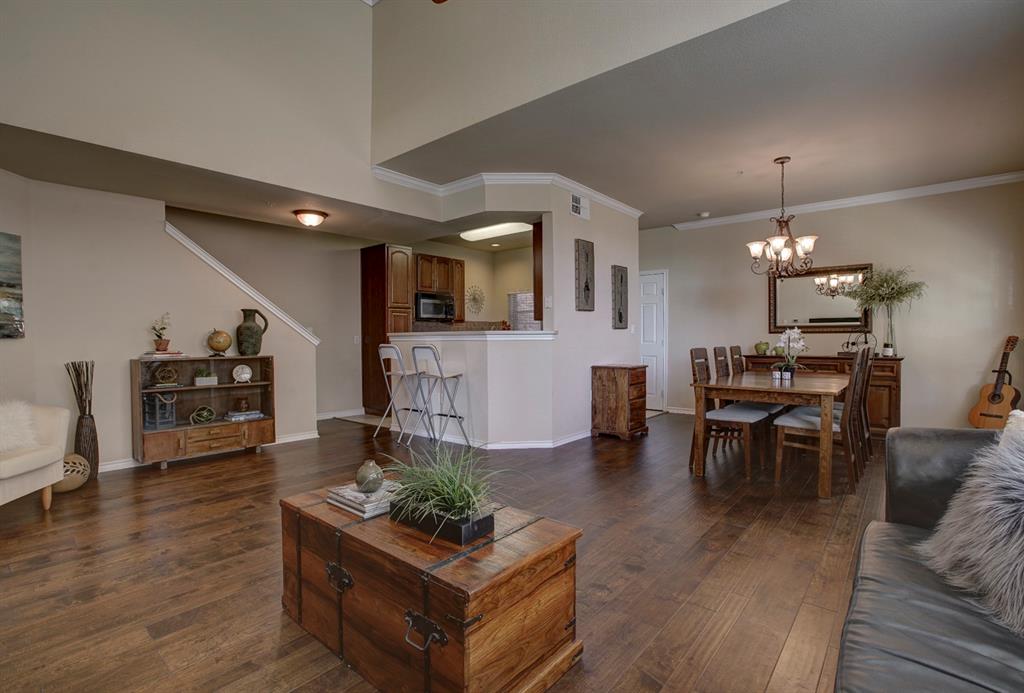 1049 Colonial Drive Coppell, TX 75019 - Photo 1 of 1 a living room with furniture and a wooden floor