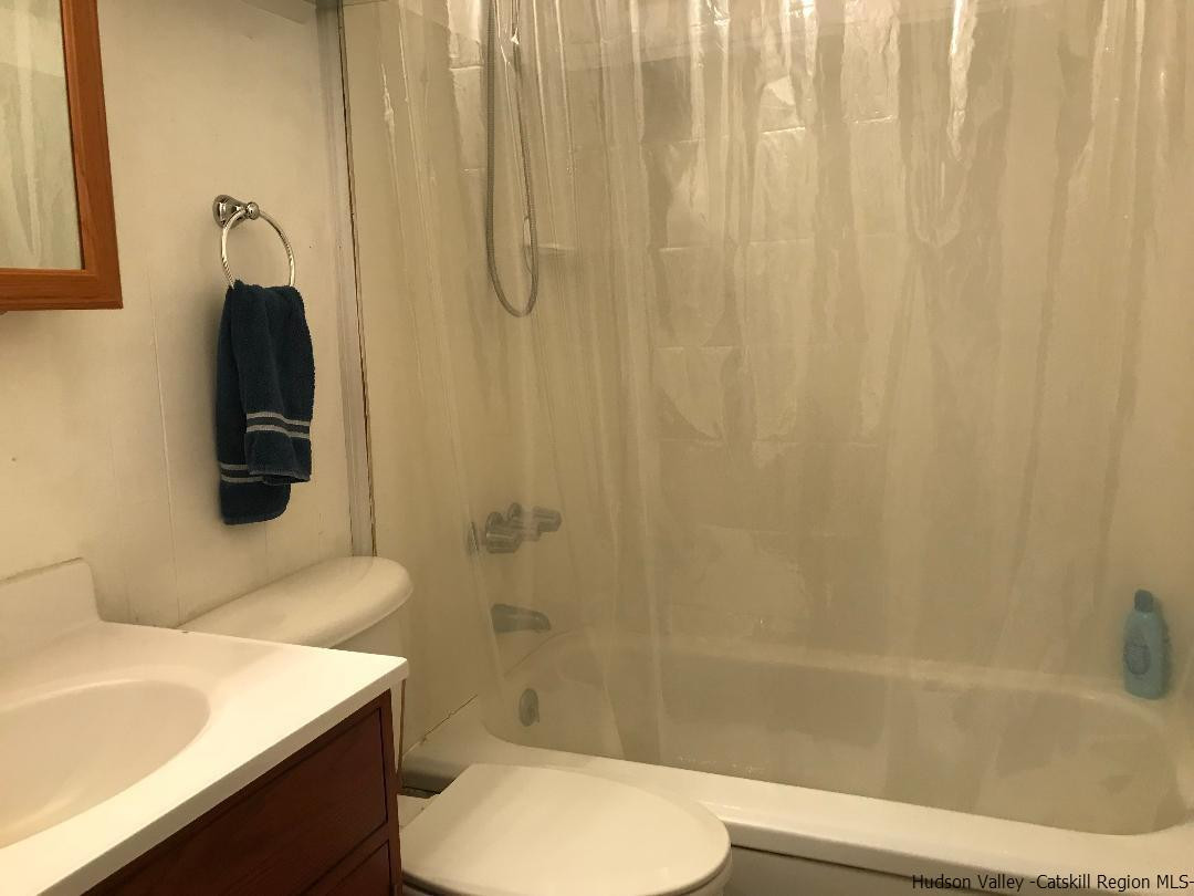 22 Wallkill Avenue Wallkill, NY 12589 - Photo 18 of 26 a bathroom with a sink toilet and shower