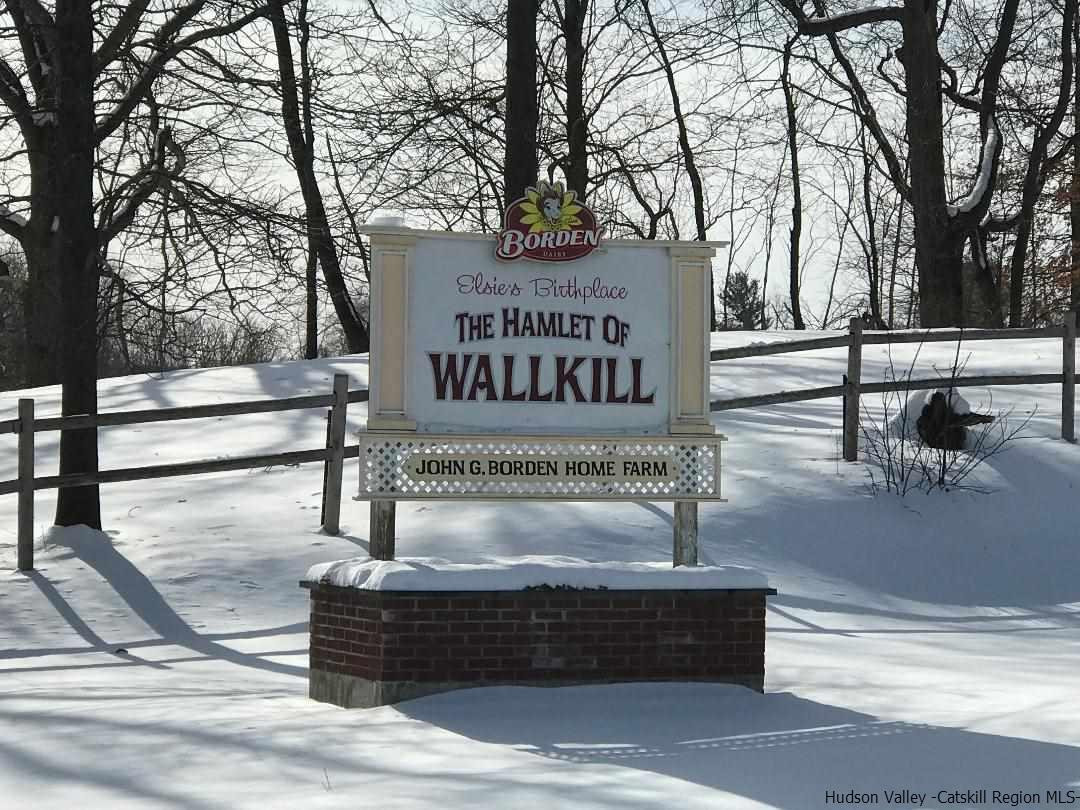 22 Wallkill Avenue Wallkill, NY 12589 - Photo 19 of 26 a sign on the side of a building