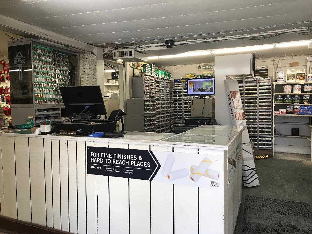 22 Wallkill Avenue Wallkill, NY 12589 - Photo 3 of 26 a kitchen with refrigerator and stove