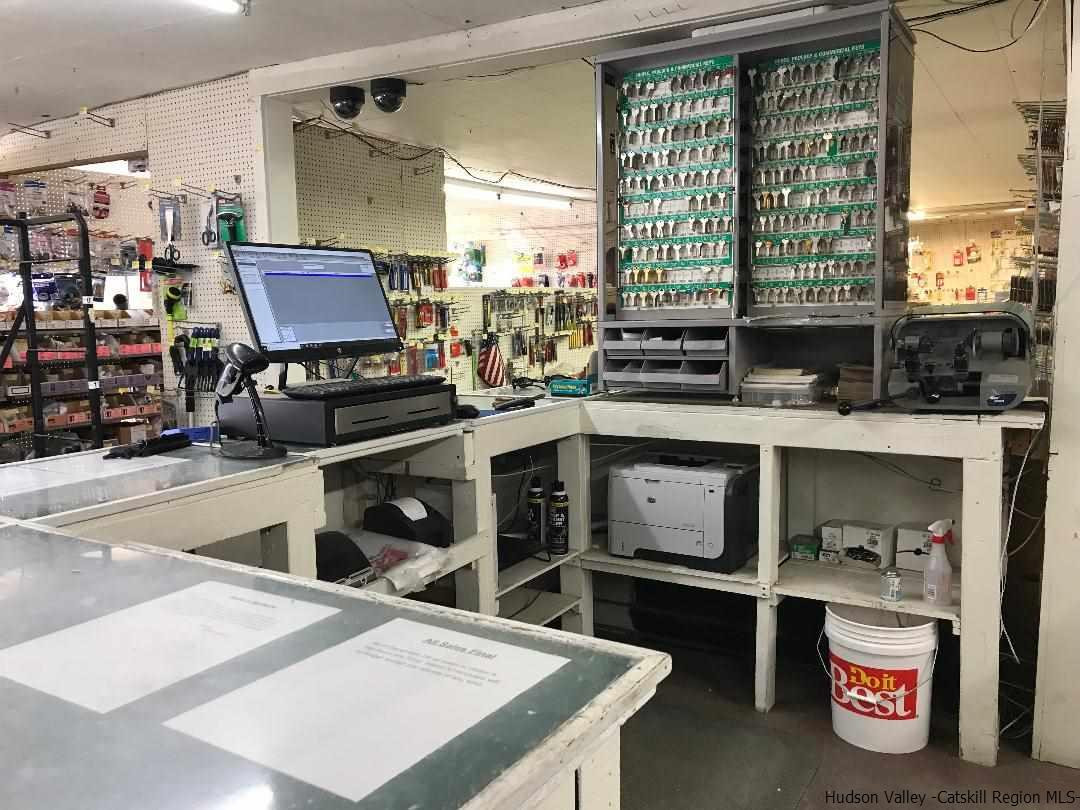 22 Wallkill Avenue Wallkill, NY 12589 - Photo 5 of 26 a kitchen with a stove a sink and a refrigerator