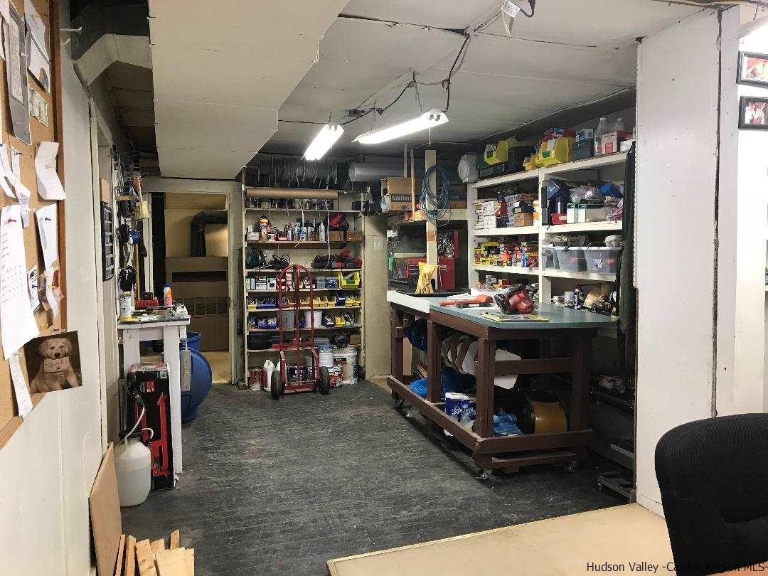 22 Wallkill Avenue Wallkill, NY 12589 - Photo 7 of 26 a room with furniture and a book shelf