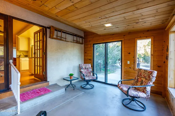 a view of outdoor space with deck and tree