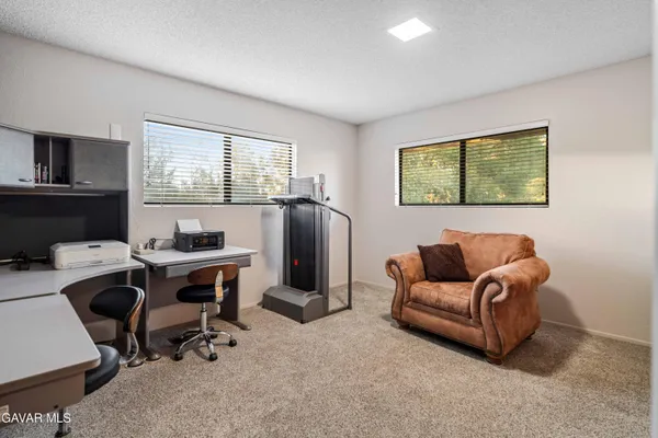 a view of a swimming pool with an outdoor seating and yard