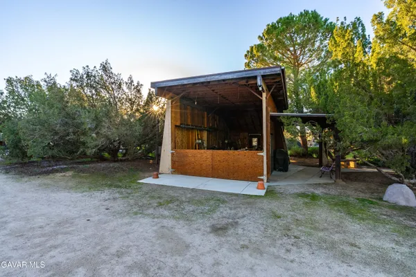 a view of a dining room with furniture and a window