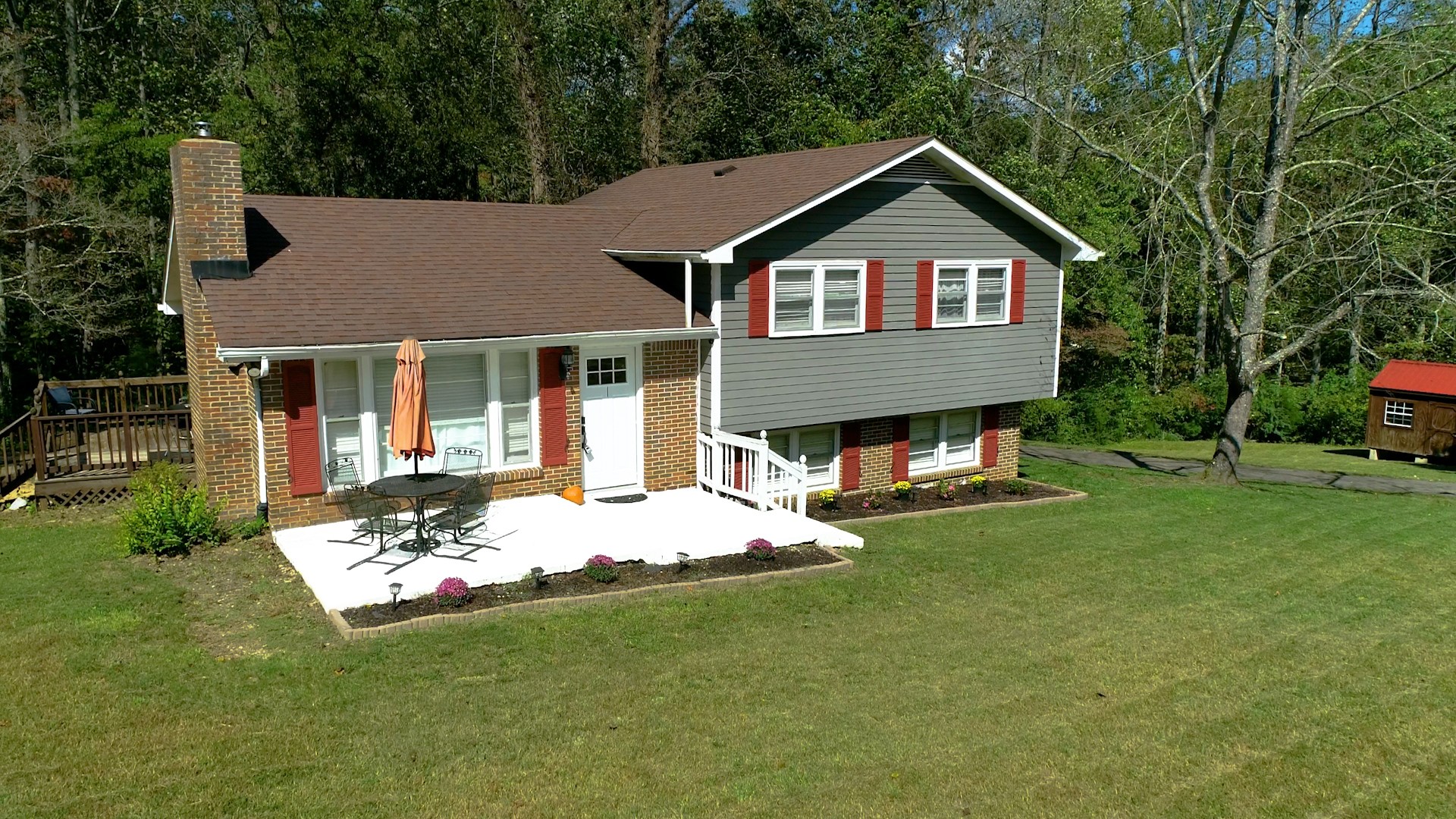 7306 Liberty Road Fairview, TN 37062 - Photo 1 of 19 a front view of a house with a garden