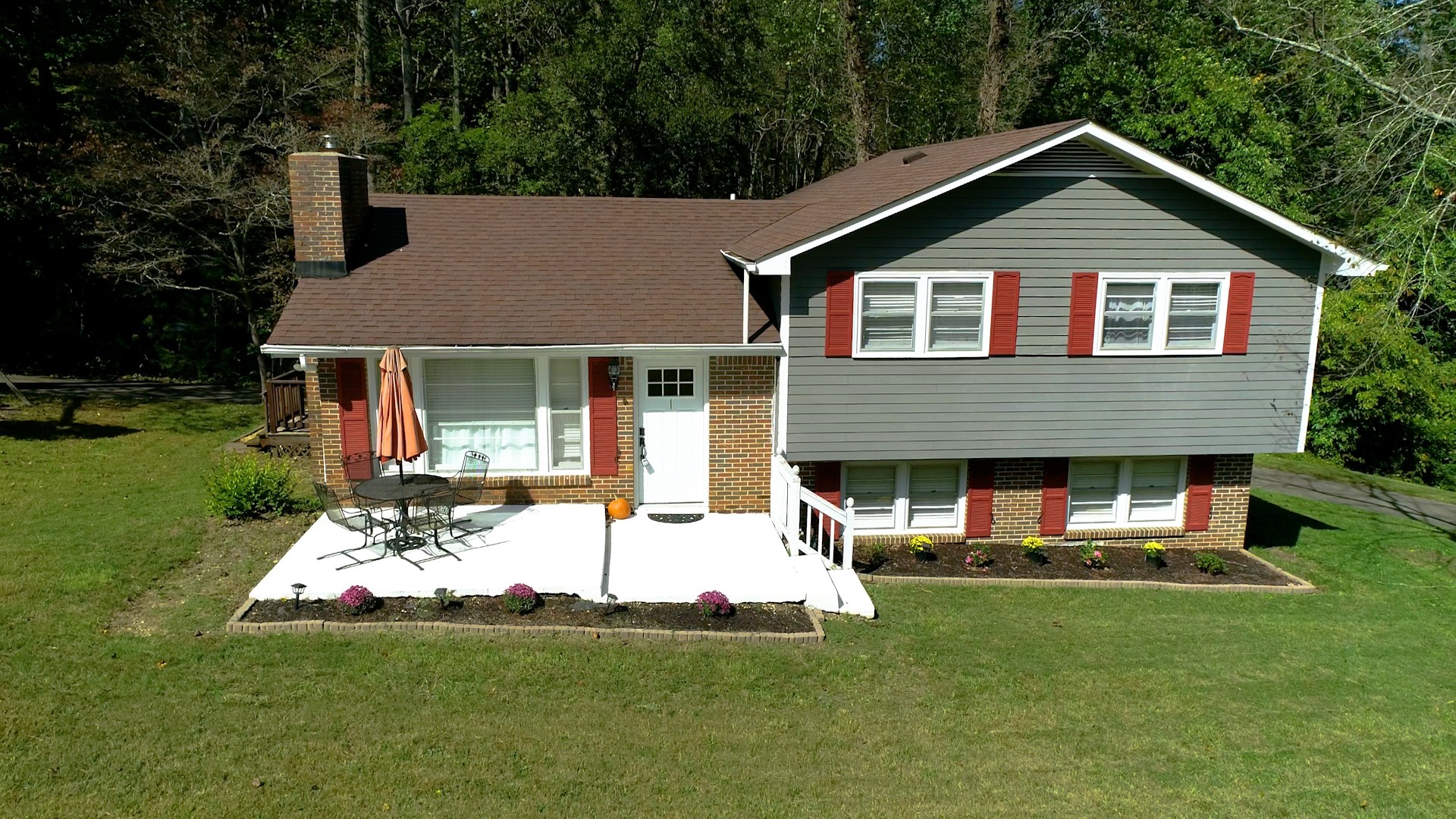 7306 Liberty Road Fairview, TN 37062 - Photo 2 of 19 a front view of a house with a yard and trees